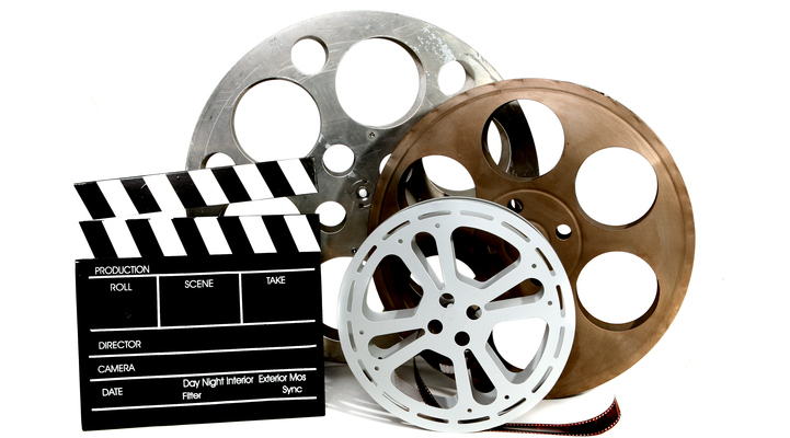 Gamla biofilmrullar med vit bakgrund